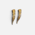 Jakris Zaria gold-plated brass earrings featuring a sculptural, tapered design with sparkling zircon stone accents.
