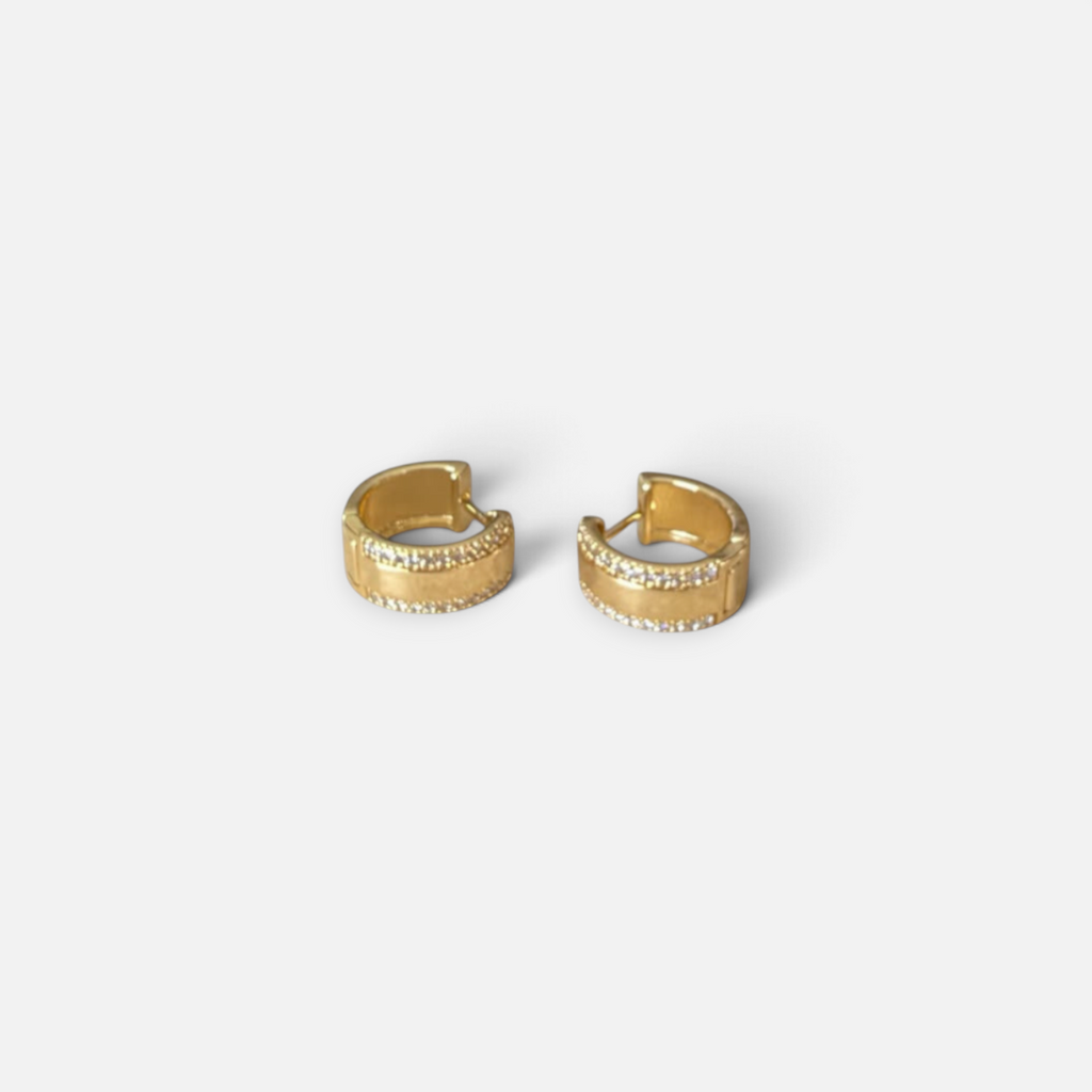 Jakris gold plated hoop earrings featuring two rows of sparkling zircon stones on a polished wide band design.