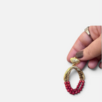 Jakris Rossa statement earring featuring 24k gold-plated textured bronze and multi-strand red coral beads