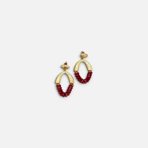 Jakris Rossa statement earrings featuring textured 24k gold plated bronze and vibrant red coral beaded drops.