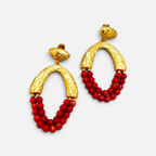 Jakris Rossa statement earrings featuring 24k gold plated textured bronze and vibrant red coral beaded drops.