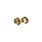 Jakris gold plated hoop earrings featuring sparkling zircon stone accents on a wide polished brass surface.