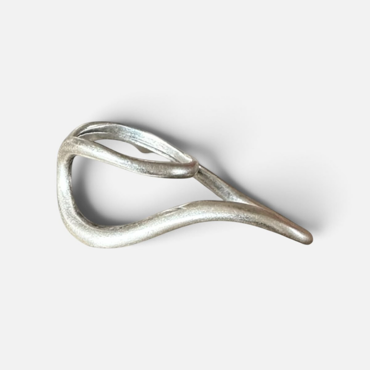 Jakris Reilly gold-plated two-finger ring with a modern, fluid sculptural design on a plain background.