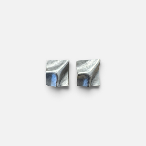 Jakris Noila sculptural square earrings in antique silver plated brass with a curved, geometric organic surface.