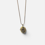 Jakris gold-plated oval locket necklace featuring a zircon-encrusted phoenix design on a delicate chain