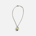 Jakris gold-plated oval locket necklace featuring a zircon-encrusted phoenix design on a delicate chain.