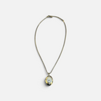 Jakris gold-plated oval locket necklace featuring a zircon-encrusted phoenix design on a delicate chain.