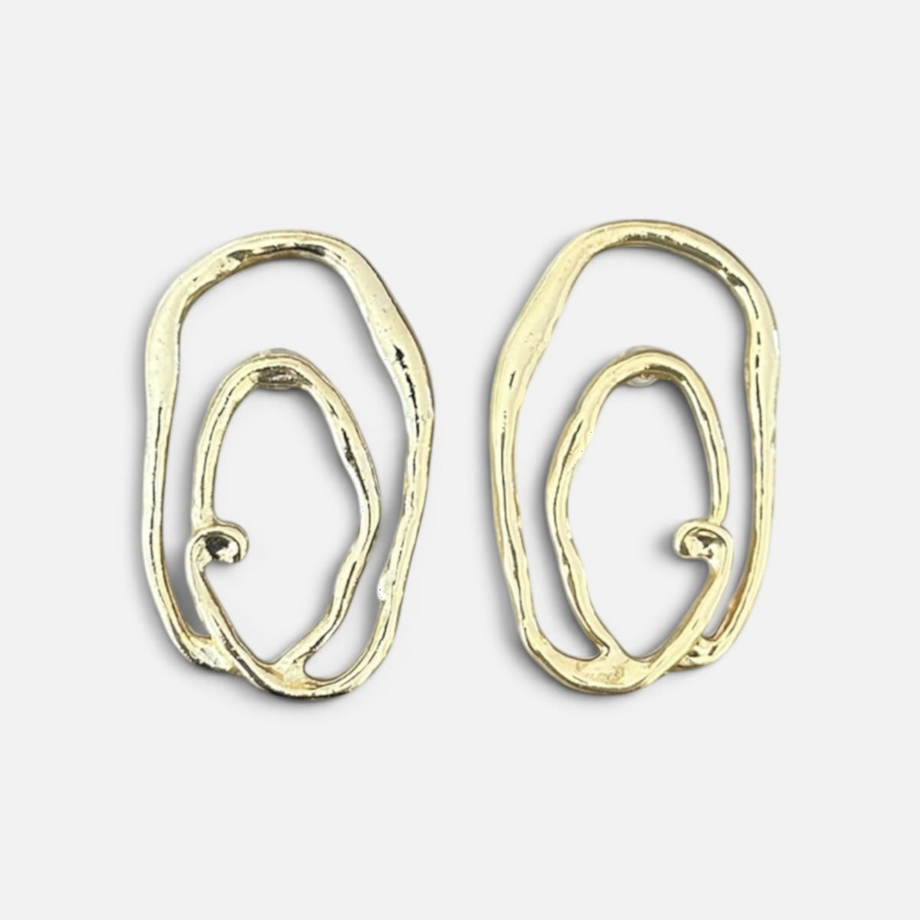 Jakris Alara gold plated brass earrings with an abstract, textured oval design and asymmetrical organic curves.