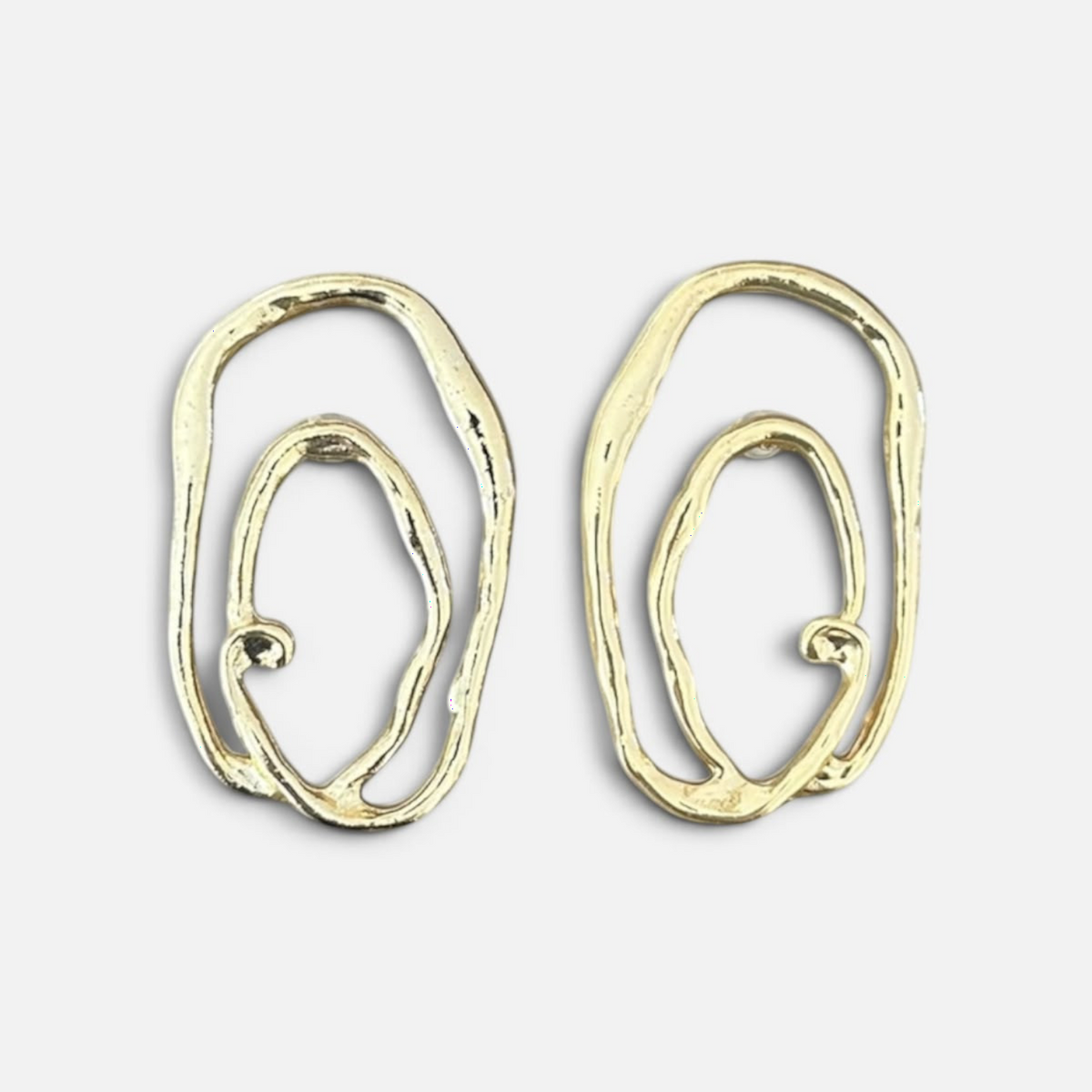 Jakris Alara gold plated brass earrings with an abstract, textured oval design and asymmetrical organic curves.