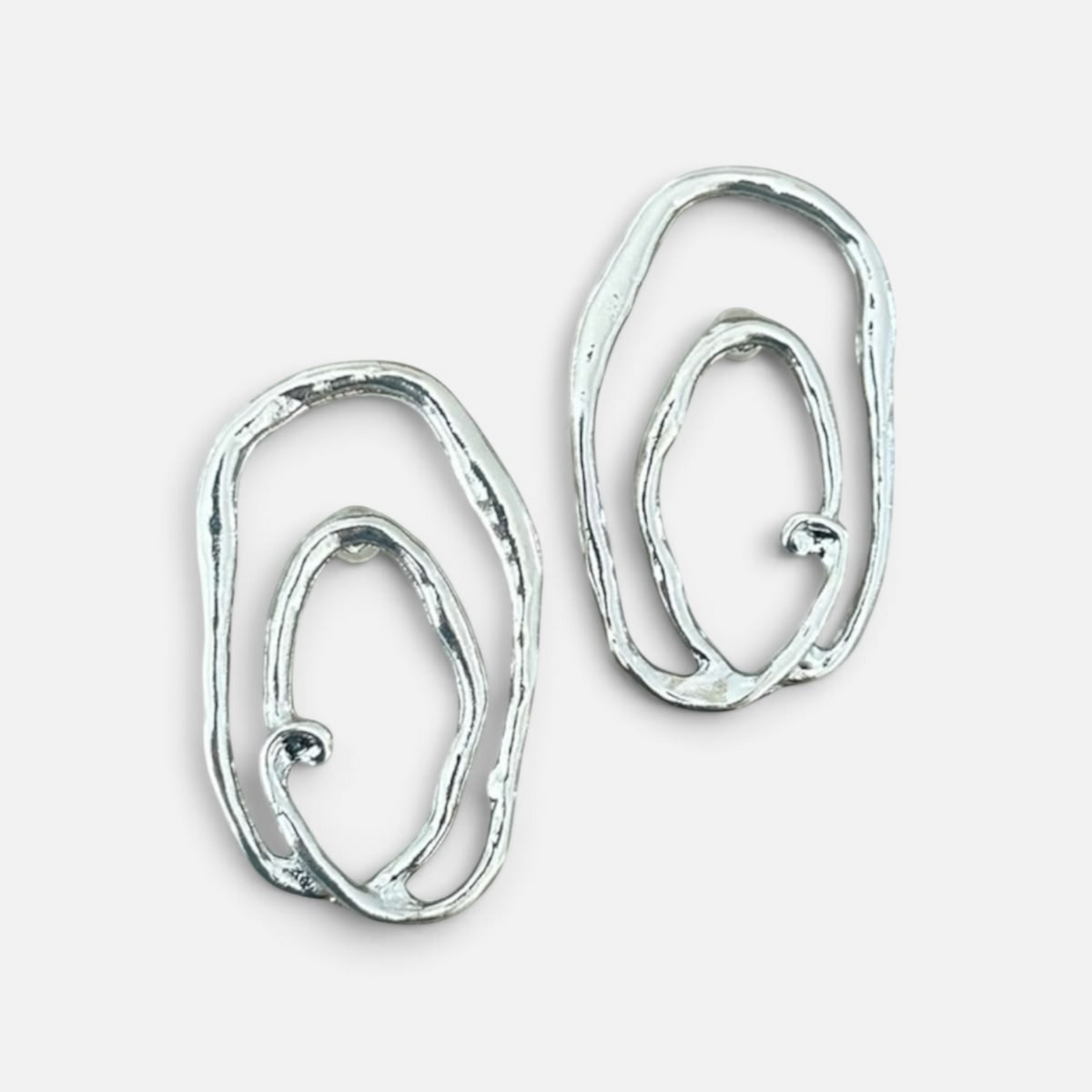 Jakris Alara silver-plated abstract oval earrings with a textured finish and organic, asymmetrical design.