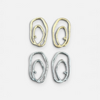 Jakris Alara abstract oval earrings in gold and silver plated brass with textured, asymmetric organic design.