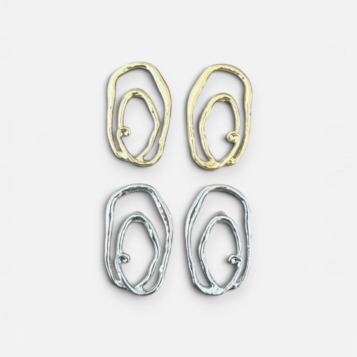 Jakris Alara abstract oval earrings in gold and silver plated brass with textured, asymmetric organic design.