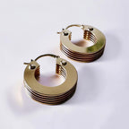 Jakris 5-layer small thick gold hoop earrings with a polished metallic finish on a white background