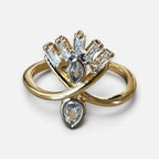 Jakris adjustable gold-tone ring featuring a decorative fan-shaped design with clear baguette and teardrop crystals.