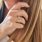 Jakris adjustable gold-plated ring featuring sparkling crystal accents on an open-style band worn on a finger