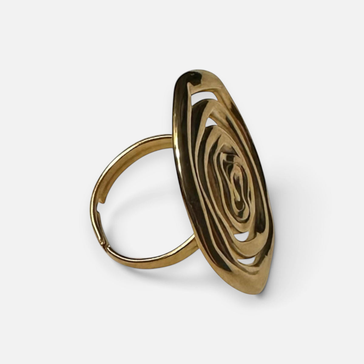 Jakris adjustable gold ring featuring a handcrafted artistic spiral design on a white surface.