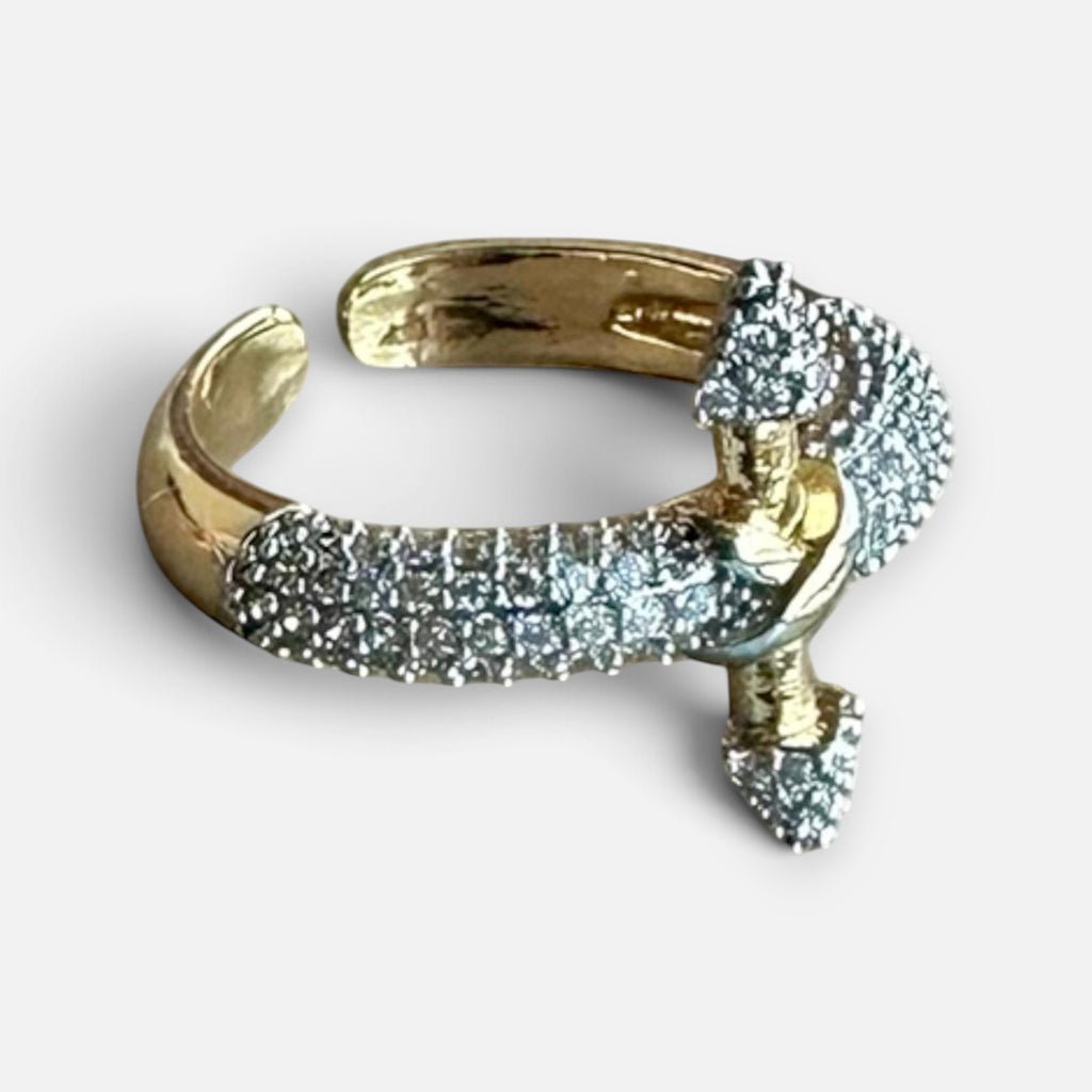 Jakris adjustable gold-plated arrow ring featuring sparkling white zircon stones in a modern open design.