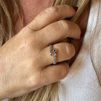 Jakris adjustable crossover ring featuring delicate star motifs with sparkling stones worn on a woman's finger