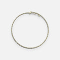 Jakris adjustable thin gold choker necklace with a delicate textured bead design on a white background