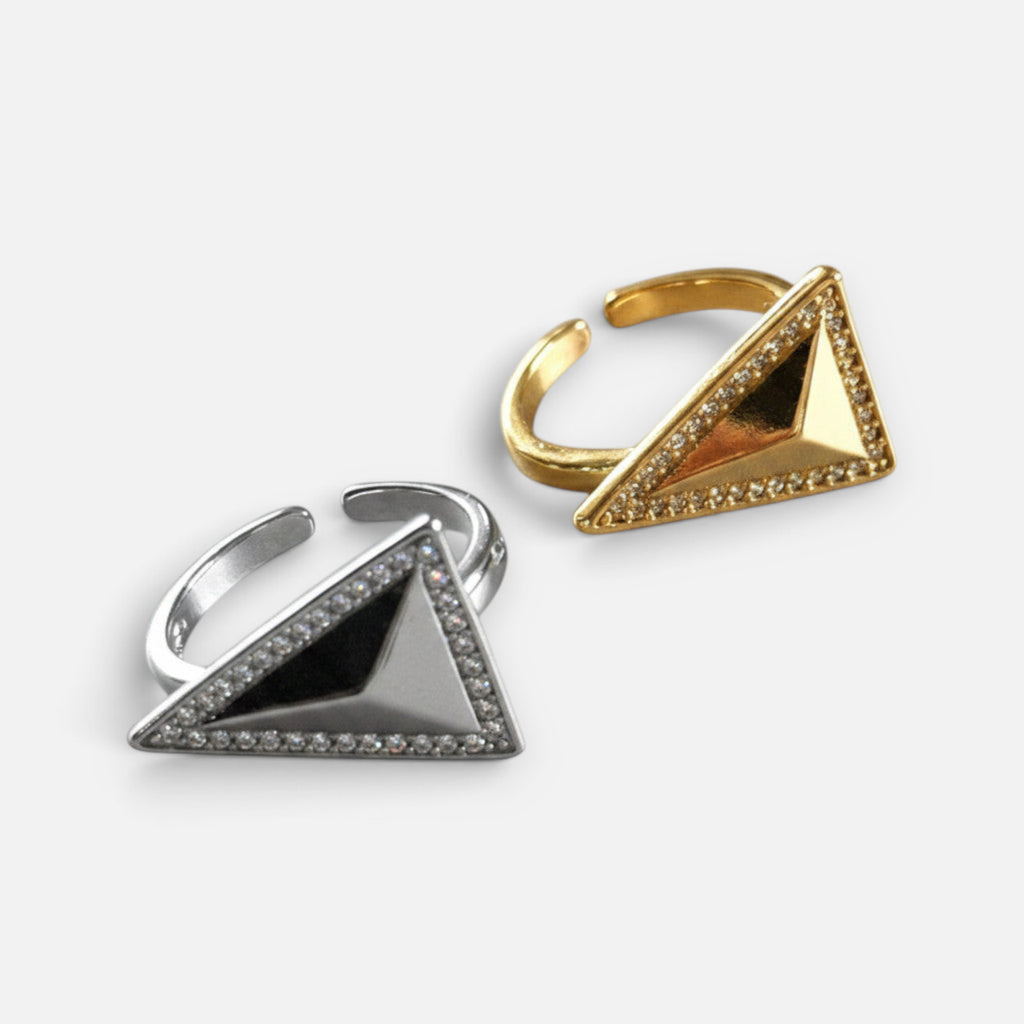 Jakris adjustable rings with pyramid triangle crystals in gold and silver tones on a white background