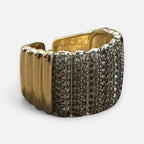 Jakris adjustable gold-tone ring featuring a wide band with sparkling zircon stone embellishments