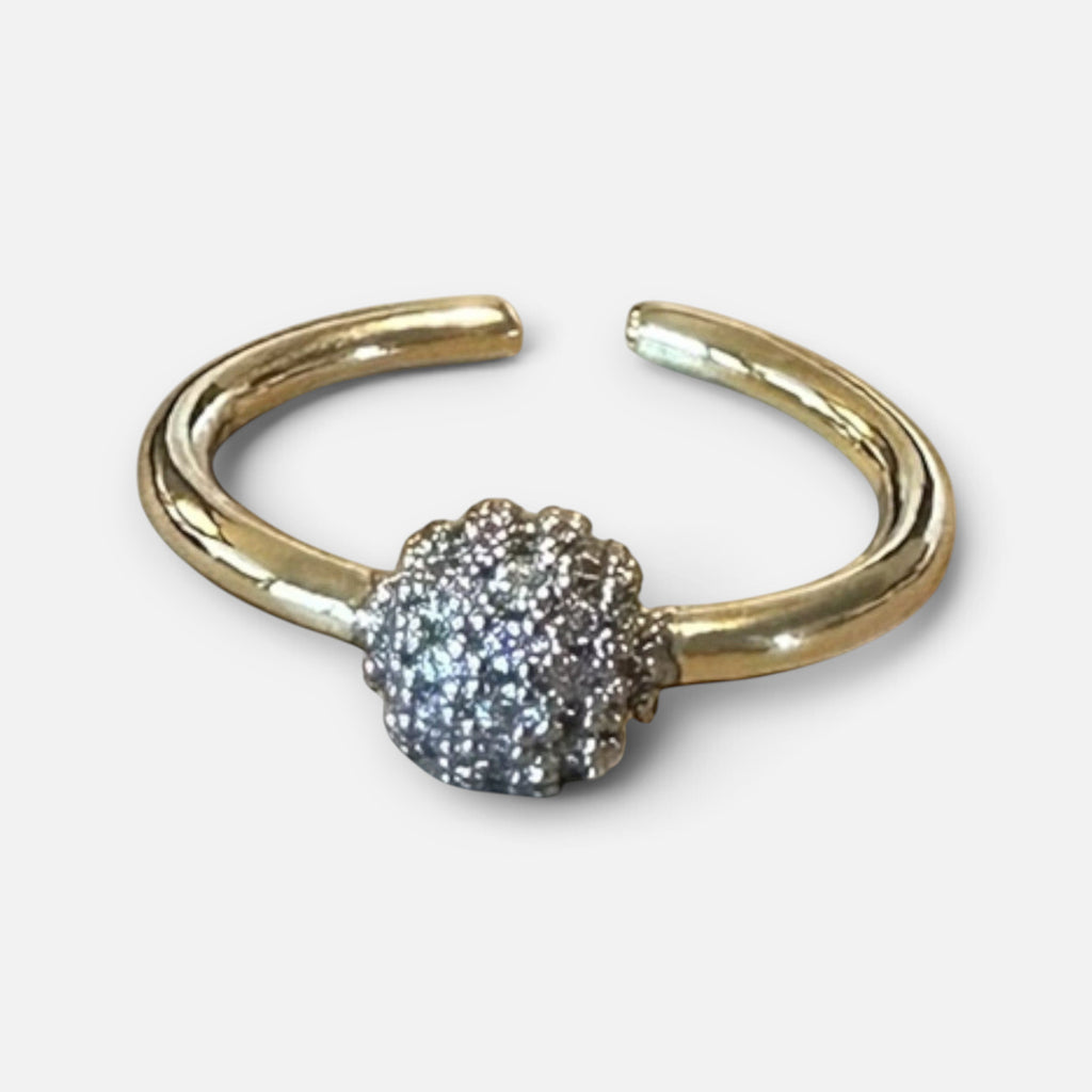 Jakris adjustable gold ring featuring a small spherical charm encrusted with sparkling white zircon stones