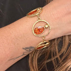 Jakris altın kaplama pirinç, amber renkli mine detaylı, vintage esintili şık oval formlu statement bileklik