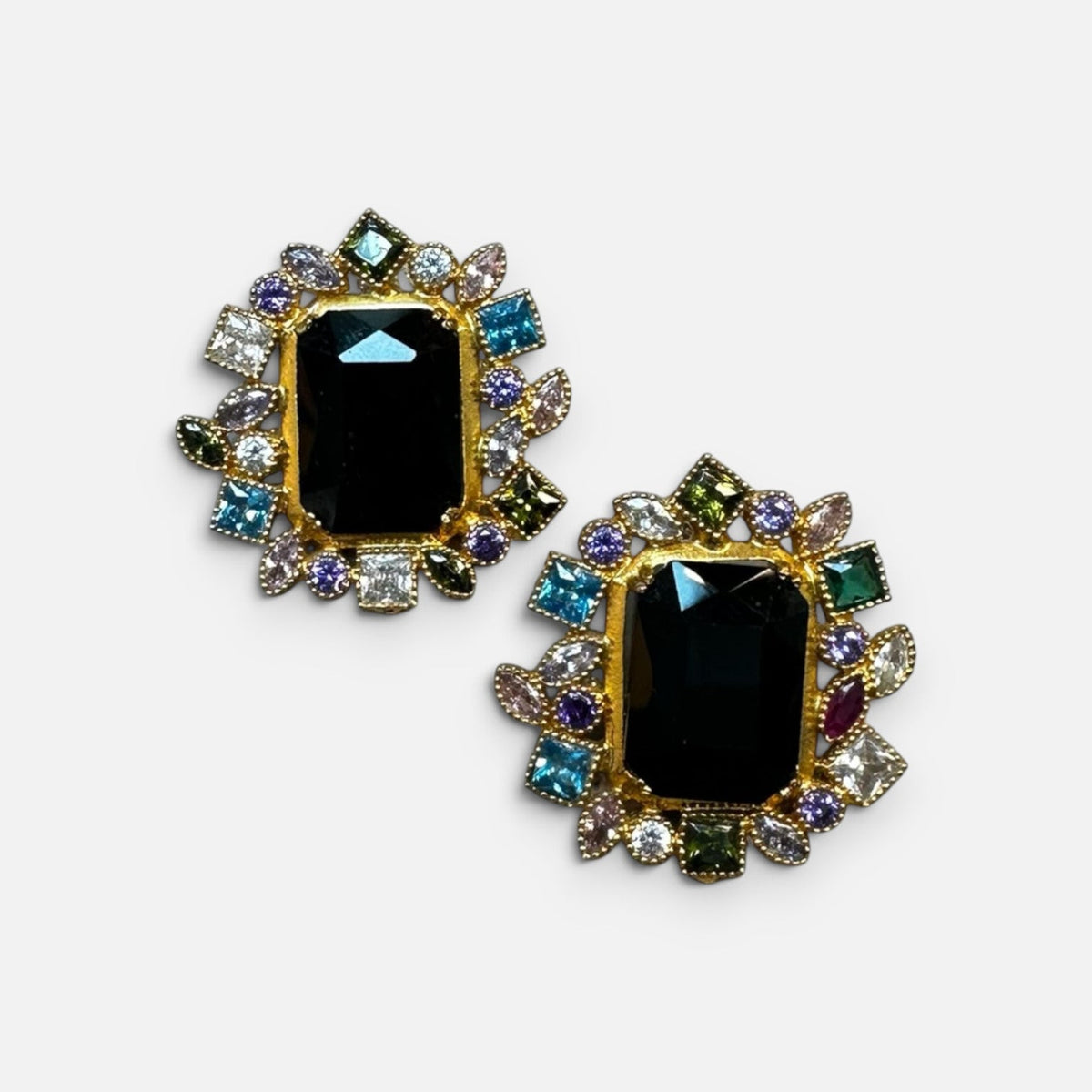 Jakris gold-tone earrings featuring a central black onyx-style stone surrounded by colorful zircon crystals.