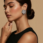 Jakris flower-shaped stud earring with black and clear zircon stones worn by a woman with a sleek bun hairstyle
