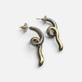 Jakris limited edition curved earrings in brass and white gold plating with a unique twisted design