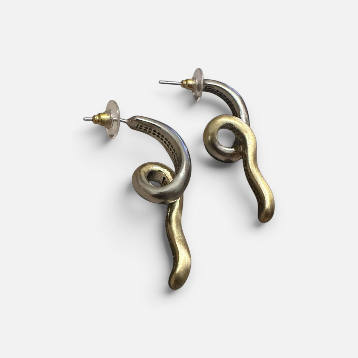 Jakris limited edition curved earrings in brass and white gold plating with a unique twisted design
