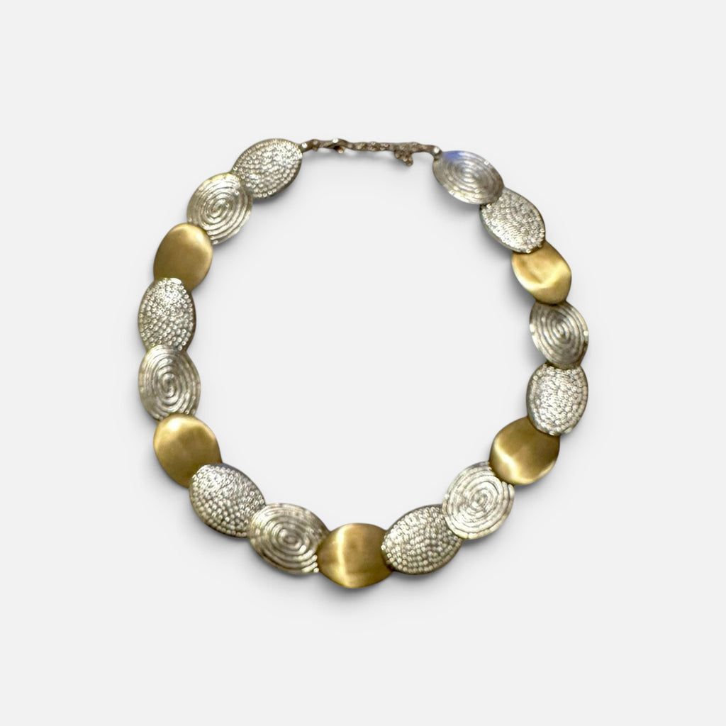 Jakris handcrafted limited edition necklace featuring alternating gold brass and white gold plated textured discs.