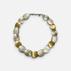 Jakris handcrafted limited edition necklace featuring alternating gold brass and white gold plated textured discs.