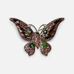 Jakris vintage butterfly brooch featuring shimmering pink textured metal and colorful crystal accents