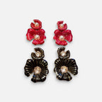 Jakris flower earrings featuring red and black enamel petals with pearl and crystal accents on a white background.