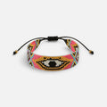 Jakris woven bead bracelet featuring a colorful evil eye pattern with pink, gold, and black glass beads