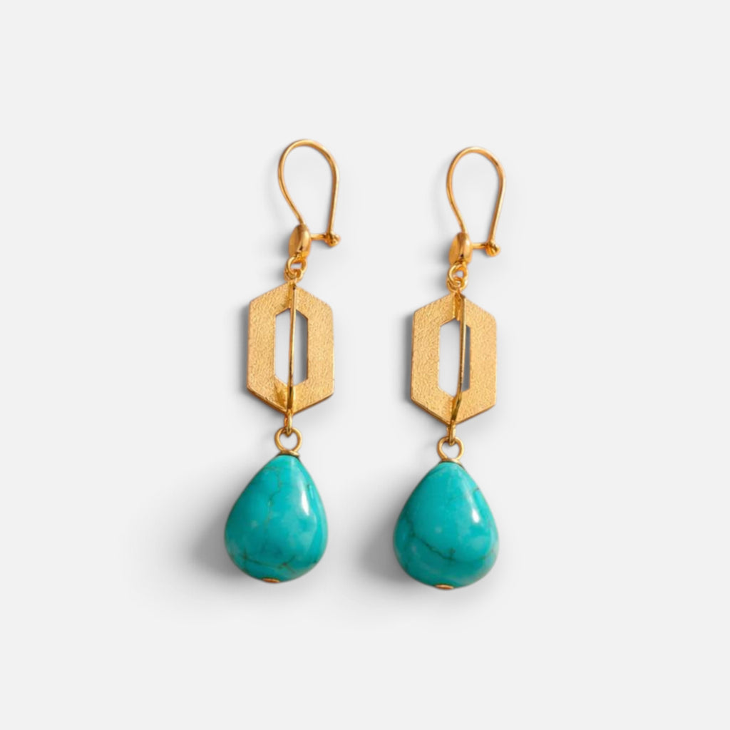 Jakris geometric drop earrings featuring 24k gold-plated bronze and teardrop-shaped turquoise stones.