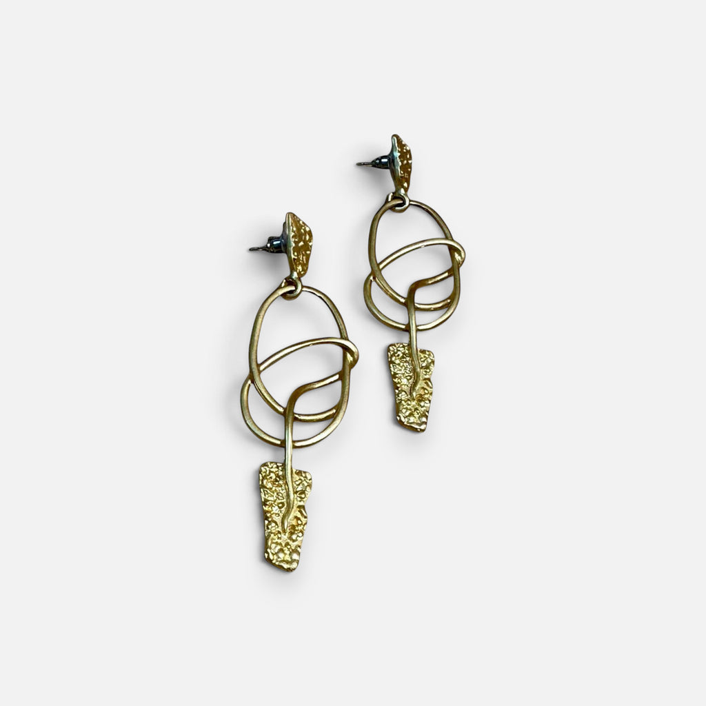 Jakris modern gold dangle earrings featuring abstract textured metal shapes and delicate circular links