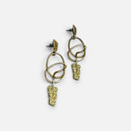 Jakris modern gold dangle earrings featuring abstract textured metal shapes and delicate circular links