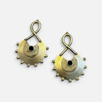 Jakris gold plated brass earrings with black stone inlay, featuring an ethnic textured design and beaded edges.