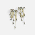 Jakris gold-tone long dangle earrings featuring multiple delicate chains with sparkling crystal leaf accents.