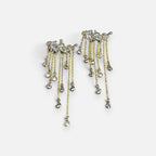 Jakris gold-tone long dangle earrings featuring multiple delicate chains with sparkling crystal leaf accents.