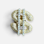 Jakris gold-tone dollar sign brooch featuring a textured surface and a vertical row of sparkling clear crystals.