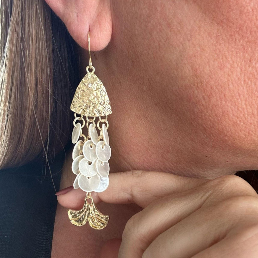 Jakris gold-toned mermaid-inspired drop earrings featuring textured metal and white beaded fish-shaped accents
