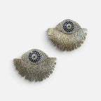 Jakris gold-plated fringe earrings featuring a blue evil eye nazar bead design with sparkling stone accents.