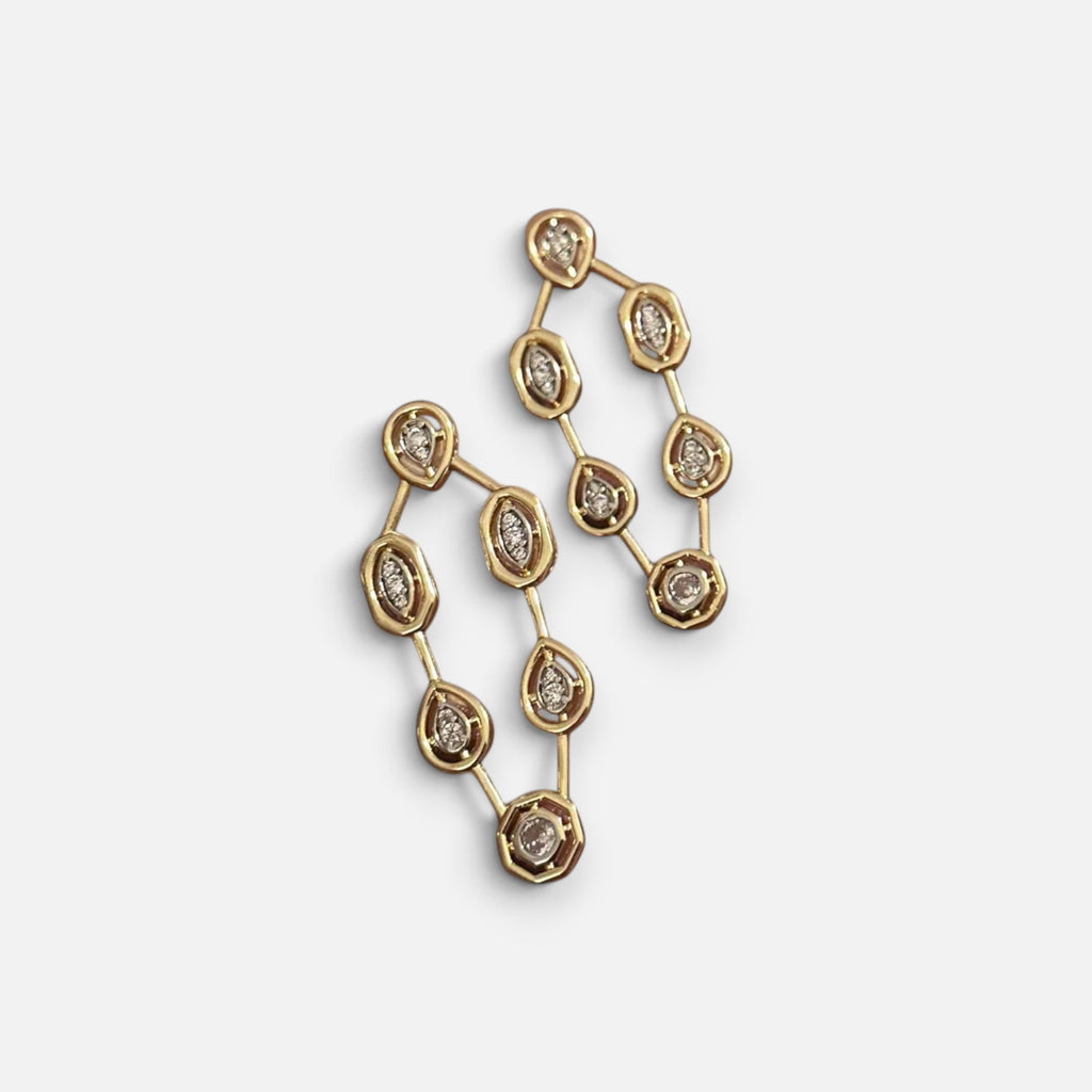 Jakris gold geometric drop earrings featuring sparkling crystal accents in a delicate linked design