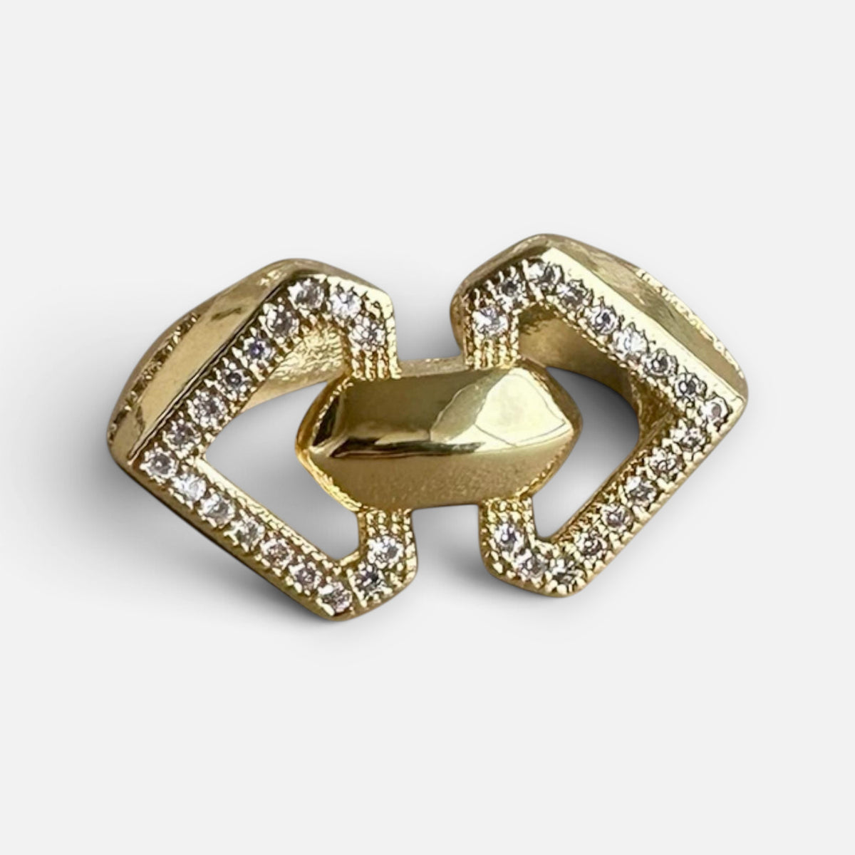 Jakris adjustable gold-tone geometric ring featuring a chain-link design with sparkling crystal accents.