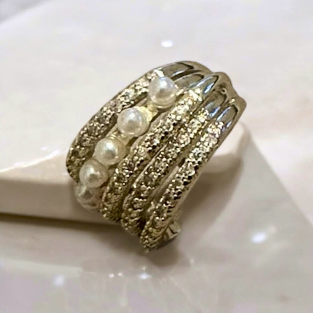 Jakris gold-tone non-pierced cartilage ear cuff featuring a row of delicate pearls and sparkling crystal accents.
