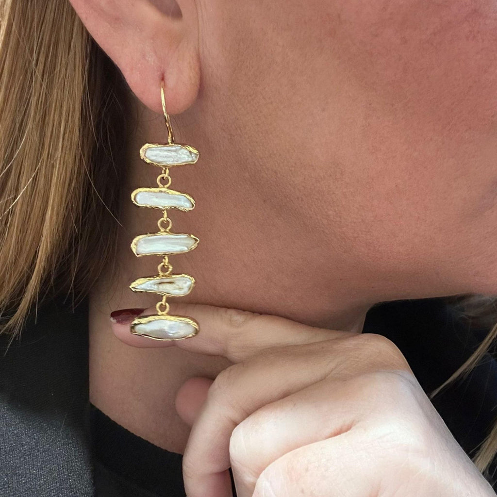 Jakris gold-plated drop earrings featuring five horizontal white baroque pearls in a minimalist bridal style