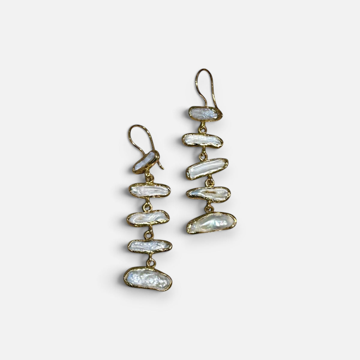 Jakris gold drop earrings featuring multiple irregular white pearls in a minimalist bridal design